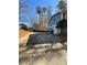 View of the backyard, featuring a house with blue siding and a patio area, ideal for outdoor enjoyment and relaxation at 3630 High Point Sw Ln, Atlanta, GA 30331