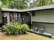 Exterior view of home with spacious deck and well-maintained landscaping at 3630 High Point Sw Ln, Atlanta, GA 30331