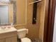 Bathroom featuring a shower with modern fixture, a stylish vanity, and elegant tile work at 3630 High Point Sw Ln, Atlanta, GA 30331