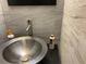 Modern bathroom sink with stylish faucet and marbled tile backsplash at 3630 High Point Sw Ln, Atlanta, GA 30331