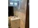 Bathroom with white sink vanity, marble backsplash, updated light fixture, and window at 3630 High Point Sw Ln, Atlanta, GA 30331