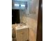 Well-lit bathroom with a modern vanity, marble-style tiles, and ample storage space for toiletries at 3630 High Point Sw Ln, Atlanta, GA 30331