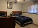 Bedroom featuring matching twin beds with wood frames and soft blue bedding and wood-look floors at 3630 High Point Sw Ln, Atlanta, GA 30331