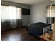 Bedroom featuring natural light, dark curtains, and an entertainment area at 3630 High Point Sw Ln, Atlanta, GA 30331