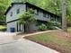 Exterior view of the house with driveway and lush landscaping, providing curb appeal at 3630 High Point Sw Ln, Atlanta, GA 30331