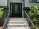 Close-up of the front door with decorative glass and secure access to the home at 3630 High Point Sw Ln, Atlanta, GA 30331