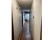 Hallway features hard wood floors and leads to a room with a wood paneled ceiling at 3630 High Point Sw Ln, Atlanta, GA 30331