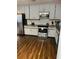 Kitchen featuring stainless steel appliances, granite countertops, and gray wood cabinets at 3630 High Point Sw Ln, Atlanta, GA 30331