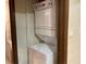 Conveniently placed stacked washer and dryer unit for easy laundry access at 3630 High Point Sw Ln, Atlanta, GA 30331