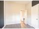 Bedroom with hard surface flooring, adjoining door, closet and gray accent wall at 546 W Sherwood Dr, Riverdale, GA 30274