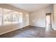 Living room featuring hard surface floors, view of front yard, and entry door at 546 W Sherwood Dr, Riverdale, GA 30274