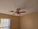 An empty bedroom featuring tile floors, a ceiling fan, and a window with blinds for ample natural light at 634 S Jeff Davis S Dr, Fayetteville, GA 30215