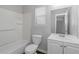 Well-lit bathroom with a tiled shower and a full vanity at 1458 Walnut Log Pl, Austell, GA 30168