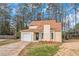 Inviting two-story home with garage, light yellow siding, and front yard at 1458 Walnut Log Pl, Austell, GA 30168