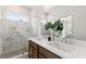 Bathroom with a double vanity, marble tiled shower, and tile flooring at 2537 Astaire Ct, Atlanta, GA 30318