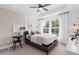 Inviting bedroom featuring a large bed, bright windows, and stylish decor accents at 2537 Astaire Ct, Atlanta, GA 30318