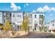 Modern townhome exterior showcasing a neatly landscaped front yard and contemporary architectural details on a sunny day at 2537 Astaire Ct, Atlanta, GA 30318