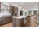 Open kitchen with stainless appliances, modern island and a view of the living room at 2537 Astaire Ct, Atlanta, GA 30318