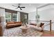 Upstairs living room with an area rug, comfortable seating, and staircase access at 2537 Astaire Ct, Atlanta, GA 30318