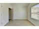 Bright bedroom featuring luxury vinyl plank flooring, a closet, and a window at 1062 Haley Woods Ct, Lawrenceville, GA 30043