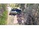A large, single-Gathering home featuring a brick patio and surrounded by tall trees on a spacious lot at 210 Cowan Se Rd, Conyers, GA 30094