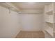 Walk-in closet with shelving and tiled floors at 210 Cowan Se Rd, Conyers, GA 30094