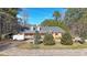 Inviting single-story home with a front porch and manicured landscaping at 210 Cowan Se Rd, Conyers, GA 30094
