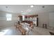 Bright kitchen with stainless steel appliances, tile floors, wood cabinets, and a breakfast table at 210 Cowan Se Rd, Conyers, GA 30094