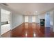 Spacious living room with hardwood floors, fireplace, and natural light from large windows at 210 Cowan Se Rd, Conyers, GA 30094