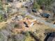 Bird's-eye view of the home, highlighting the spacious yard and surrounding trees at 303 Wood Wind Dr, Woodstock, GA 30189