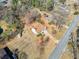 High angle shot displaying the well-maintained lawn and proximity to neighboring homes at 303 Wood Wind Dr, Woodstock, GA 30189
