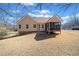 Exterior view of a charming single-Gathering home with a large, well-maintained yard at 303 Wood Wind Dr, Woodstock, GA 30189