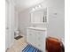 Bathroom featuring a tile floor, ample lighting, and a single sink vanity at 303 Wood Wind Dr, Woodstock, GA 30189