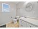 Bathroom featuring a tile floor, oval mirror, and a single sink vanity at 303 Wood Wind Dr, Woodstock, GA 30189