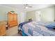 Bedroom with hardwood furniture, ceiling fan and carpet flooring at 303 Wood Wind Dr, Woodstock, GA 30189