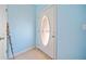 Bright entryway featuring tile floors and a front door with decorative glass panel at 303 Wood Wind Dr, Woodstock, GA 30189