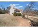 View of the front porch with white railings and a rocking chair overlooking the neighborhood at 303 Wood Wind Dr, Woodstock, GA 30189