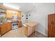 Kitchen showcases wooden cabinets, stainless steel appliances, and tiled flooring at 303 Wood Wind Dr, Woodstock, GA 30189