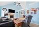 Comfortable living room with vaulted ceiling, fireplace, and neutral carpet flooring at 303 Wood Wind Dr, Woodstock, GA 30189
