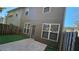 Backyard featuring a door, fenced perimeter, and a concrete patio at 115 Sunset Ln, Woodstock, GA 30189