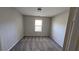 Bedroom with a light and bright feel due to window at 115 Sunset Ln, Woodstock, GA 30189