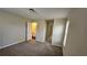 Bedroom with neutral carpet and an attached bathroom at 115 Sunset Ln, Woodstock, GA 30189