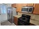 Kitchen with stainless steel refrigerator and gas range at 115 Sunset Ln, Woodstock, GA 30189