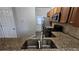 Kitchen featuring stainless steel sink and granite counters at 115 Sunset Ln, Woodstock, GA 30189