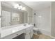 Bathroom features tile flooring, a large vanity with a mirror, and a shower-tub combination at 1876 Winding Creek Sw Ln, Marietta, GA 30064