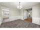 Formal dining room with wainscoting and neutral decor provides an inviting space for Gathering meals at 1876 Winding Creek Sw Ln, Marietta, GA 30064