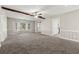 Bright living room with large bay window, plush carpeting, and stylish wainscoting at 1876 Winding Creek Sw Ln, Marietta, GA 30064