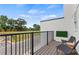 Relaxing balcony with black metal railings, wood flooring, and cozy seating area with an outdoor view at 2539 Astaire Ct, Atlanta, GA 30318