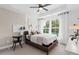 Cozy bedroom featuring a comfortable bed, stylish decor, and large windows offering great natural light at 2539 Astaire Ct, Atlanta, GA 30318