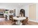 Contemporary dining room featuring stylish chairs, hardwood floors, and modern light fixtures and kitchen access at 2539 Astaire Ct, Atlanta, GA 30318